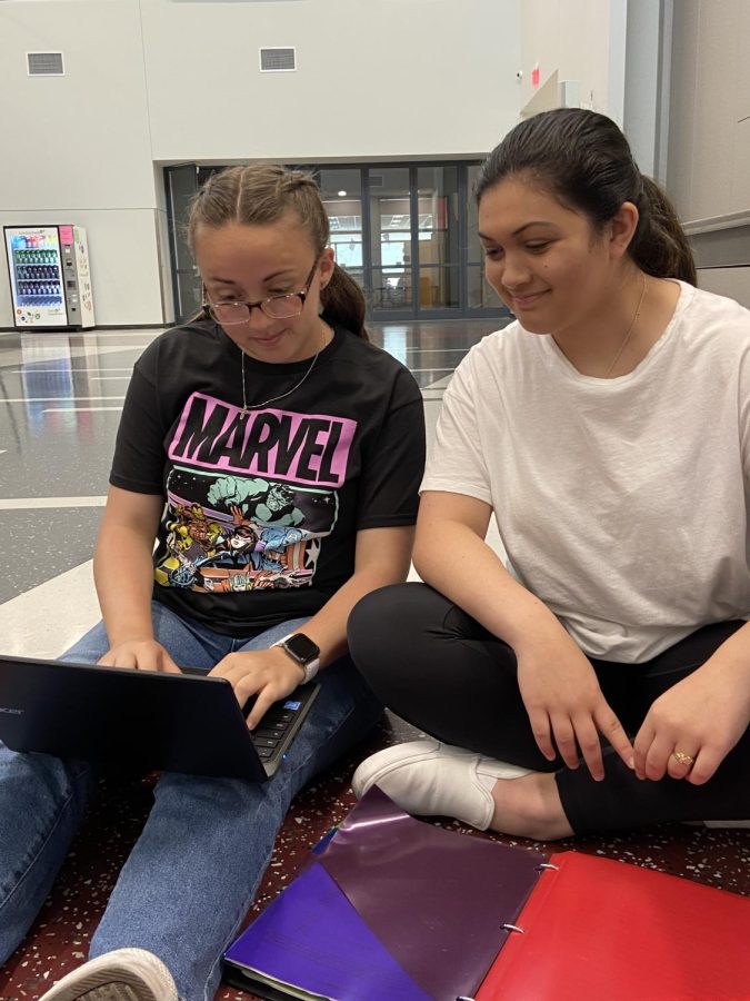 Seniors Jalya Nartatez and Destiny Montgomery sit together while Montgomery edits Nartatez’s next newspaper story. Montgomery was named Editor in Chief at the end of the 2020-2021 school year.