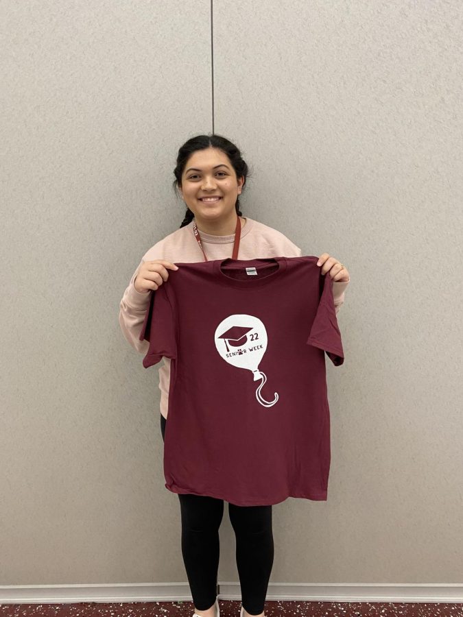 Jayla Nartatez poses with the senior week t-shirt. Senior week staff committee members all recived a shirt for senior week.