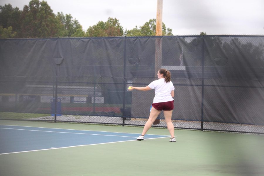 Tennis player from the girls tennis team practices for the upcoming season. 