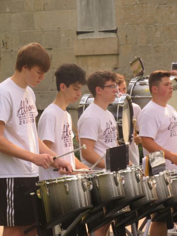 Keeping the beat. The drumline performs at Baker Mansion last year.