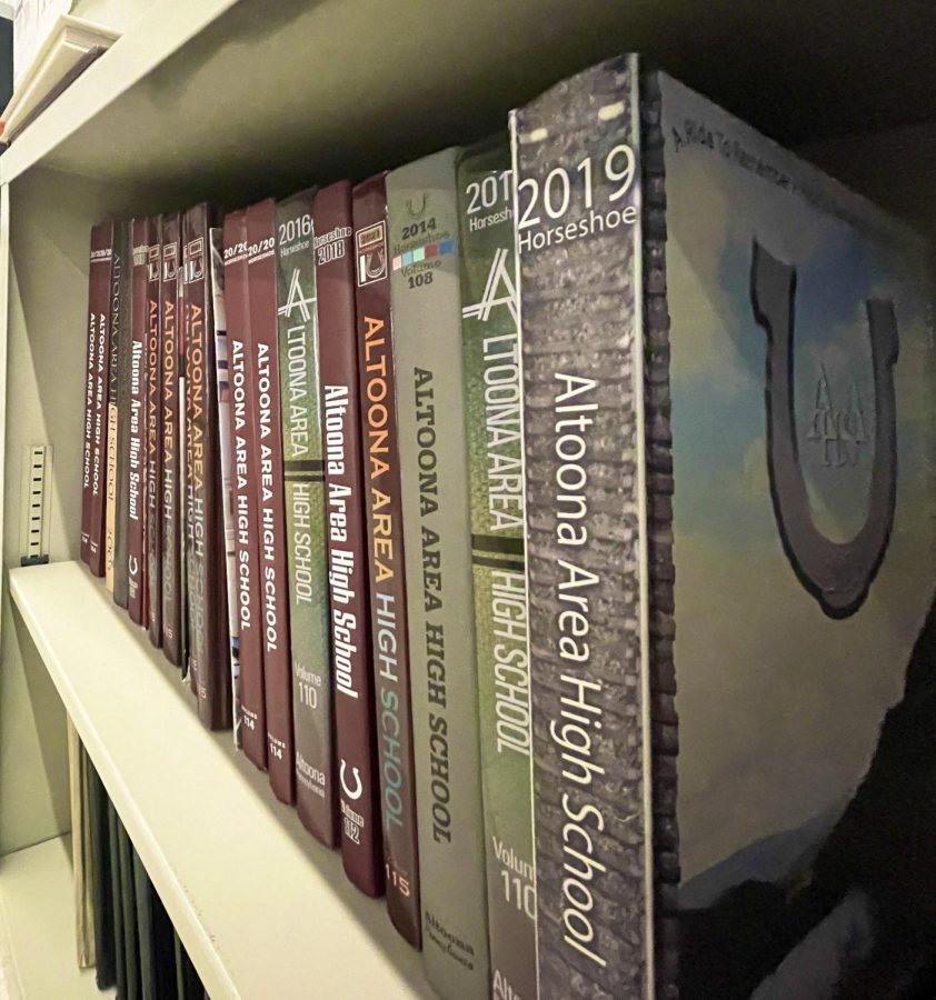 Yearbook adviser Wanda Vanish displays yearbooks of times past on a shelf in her classroom.