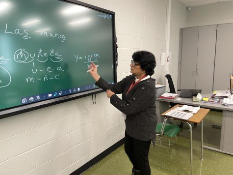 Marianela Davis uses her Smart Board to demonstrate a concept to her students.  