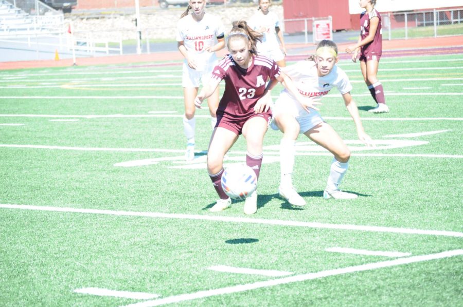 All in. Junior Hannah Vancas fights to take control of the ball.