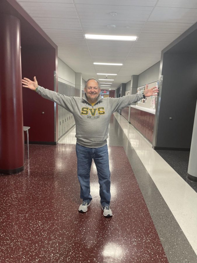 King of the world.  american and world studies teacher, Kirk Dodson, proudly shows off his Saint Vincent College hoodie before heading back to teaching. 
