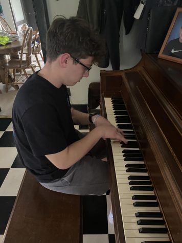 Kuhns practices piano for his upcoming lessons. Outside of school, Kuhns takes private lessons. 