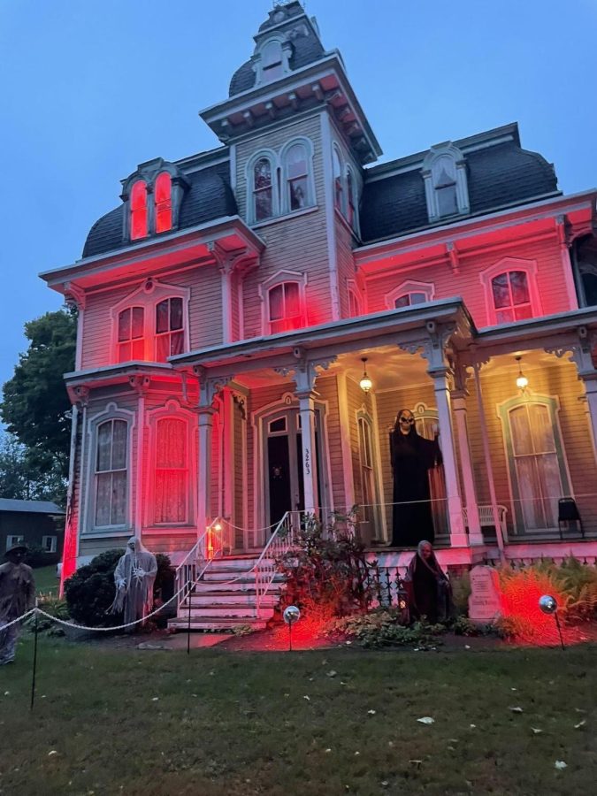 Horrifyingly Haunted  As the sun sets, the eerie red lights in the lawn turn on and flicker. The house showcased this years new storyline/theme on Friday, September 30 for each person walking through all 25 minutes of the haunted manor.