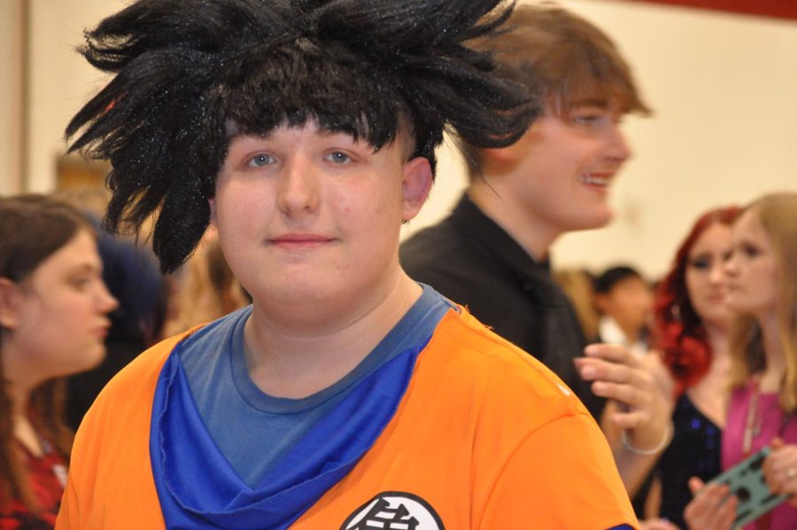 Dress to impress Senior Adam Marks walks around the Homecoming dance in a costume. Marks dressed up as Goku from Dragon Ball Z.