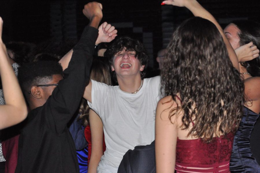 Dance like no ones watching Sophomore Jack Hartman dances with friends. Student got the chance to dance with friends while at the Homecoming Dance.