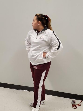 Freshman Rylee Bush shows pride by wearing her uniform on Fridays to support the football team at their away game that the band will be attending.