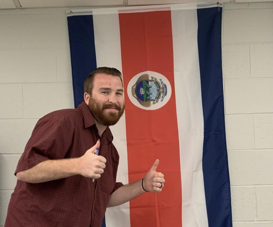 Thumbs-up! Leone has a flag of Costa Rica displayed in his classroom right above his desk. Learning Spanish has allowed him to get to know  and help people that he previously would not have been able to converse with. Once you get to a point where you can actually use the language and speak it and listen to it effectively, it literally and figuratively opens up a door to an entire other group of people that you previously were not able to have communication with, Leone said.