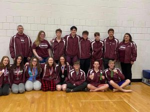 Winners. The team poses for a picture after competing at Districts in March. Some team members won their races and received medals or ribbons for them. The team hopes to return to Districts this season.