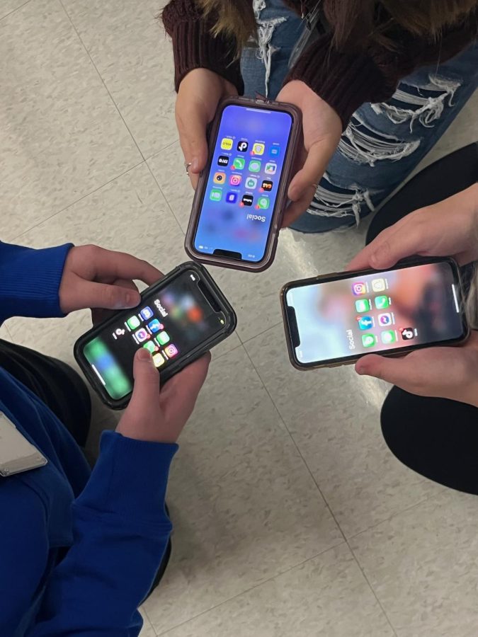 Phone apps. Three kids show their social media apps they have on their phones. They all downloaded many apps when they first got their phones. 
