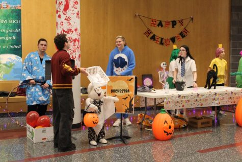 Games Galore Senior Mason Crownover, senior Kasey Reid and junior Marcella Parker set up the games for trunk-or-treat. The group set up a bowling game and a candy booth for kids to go to.