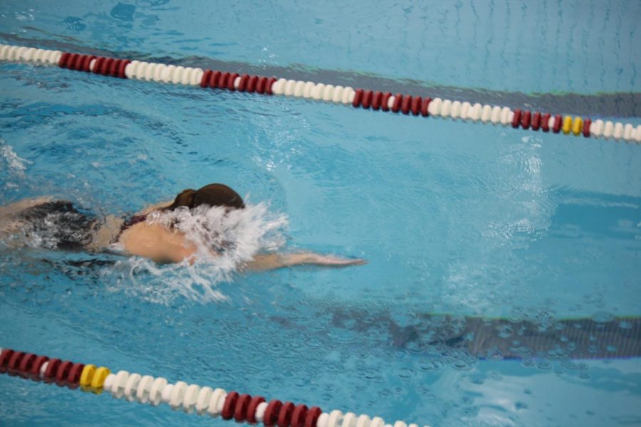 Just keep swimming. Olivia McMinn works hard during one of the swim meets she competed in for the 2021 season. Swimming is one of the many different winter sports. 