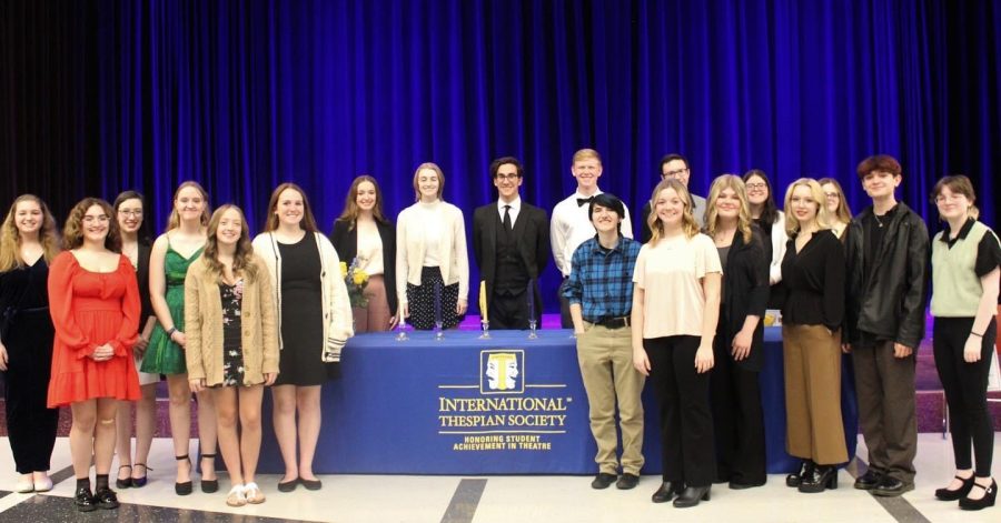 We did it. Members of the drama club smile as they become inducted into the International Thespian Society. 
