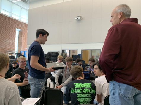 Music Mayhem Senior Austin Parker discusses with music mentor Larry Detwiler about his genius hour project. Parker’s project will bring a brass quartet back to the high school to perform and have fun.  