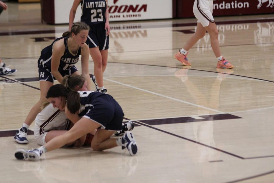 On It Sophomore Mya Mielnik fights for the ball on the ground after losing it.