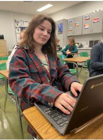 Working Hard.
Typing away on her keyboard, freshman Gabrielle Beldin works on an assignment for her civics class. The assignment is on the parts of Congress, which could appear on the Citizenship test.
