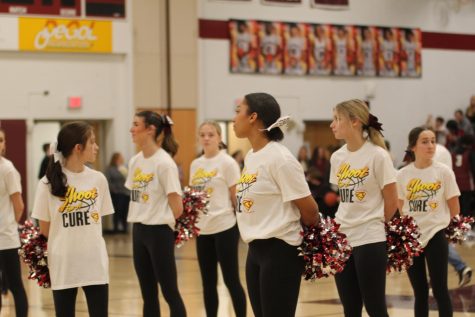 Pep rally spirit.  Cheerleaders wear their Shoot for a cure t-shirts during the January pep rally.  The school continued to support the cause at the game that night.