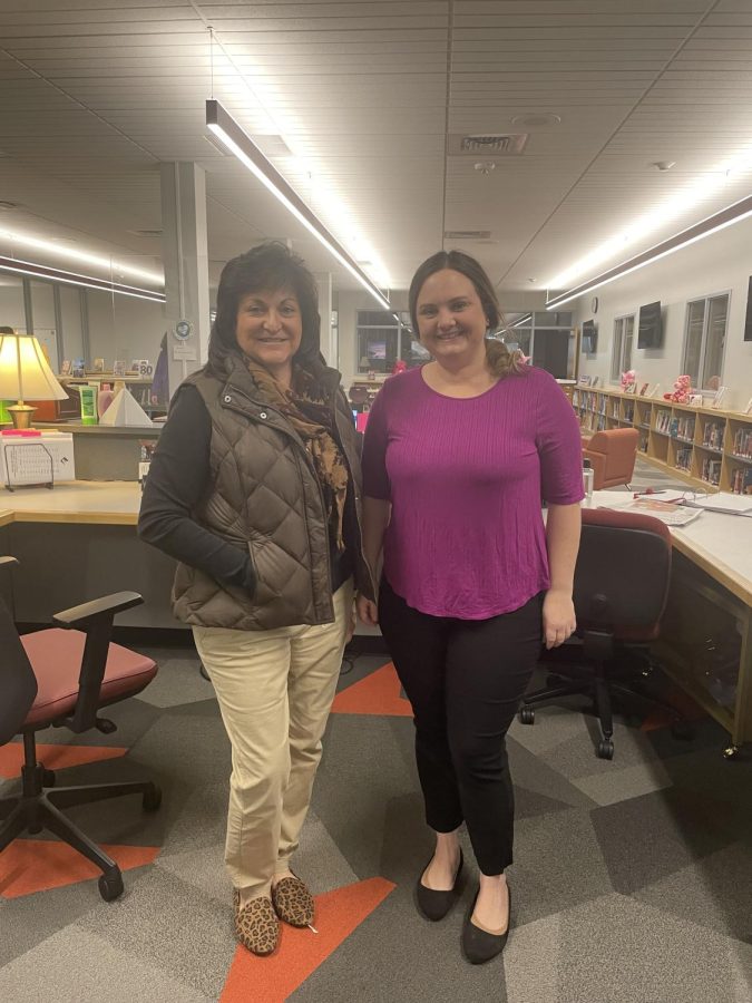Making friends. Library staff members Barbara Caracciolo and Danielle McNelis pose for a picture before going back to work. 