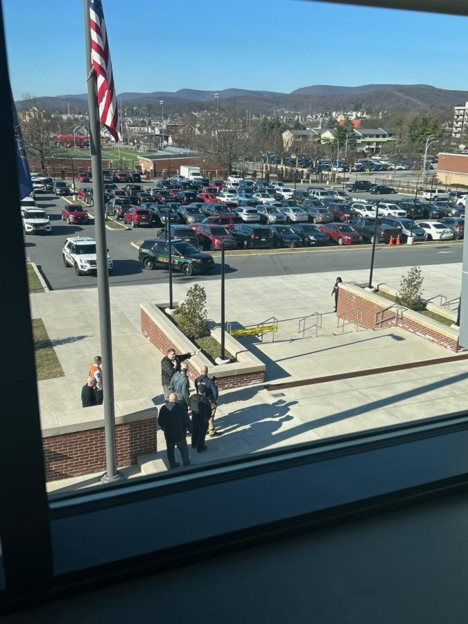 Law enforcement responds to the active shooter calls and filled the school parking lot.