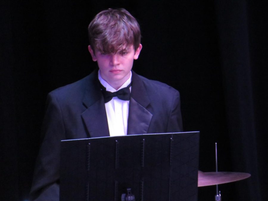 Tapping to the beat of my own drum. Junior Ryan Longstreth plays the snare drum during the concert. 