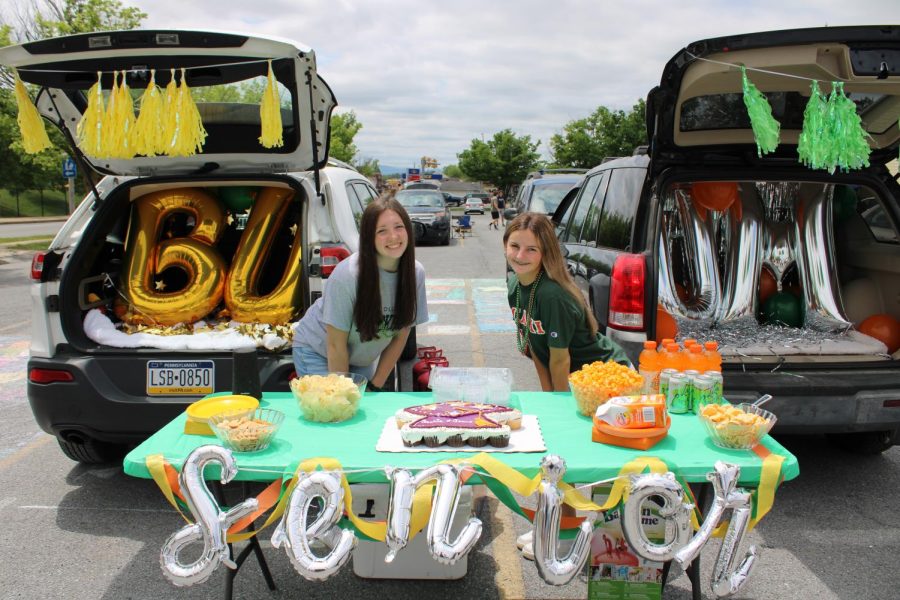 Senior Week 2022 Seniors Jenna Williams and Gracie Weaver decorate their cars for the first ever senior tailgate. The idea of the event was suggested by Williams. 