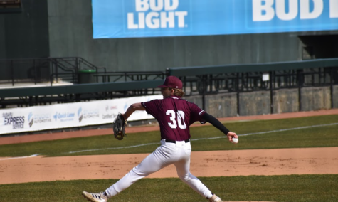 For the love of the game. Sophomore Aaron Smearman steps forward on the pitcher’s mound to pitch the ball to the batter. 
