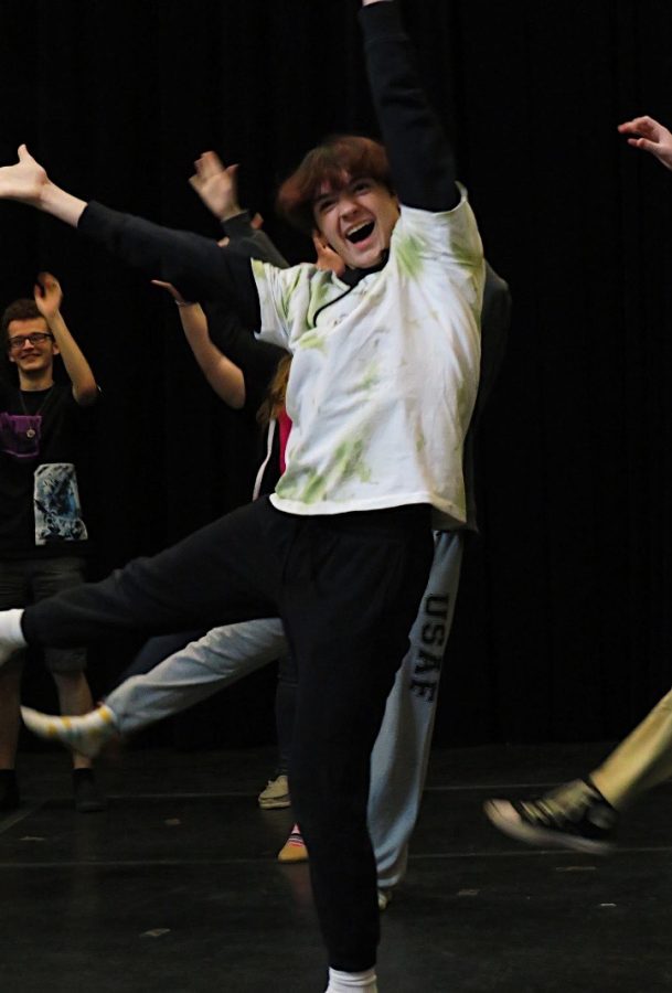 Junior Ethan Eisenhart dances away during rehearsal. Eisenhart plays  Billy Lawlor in the play. 
