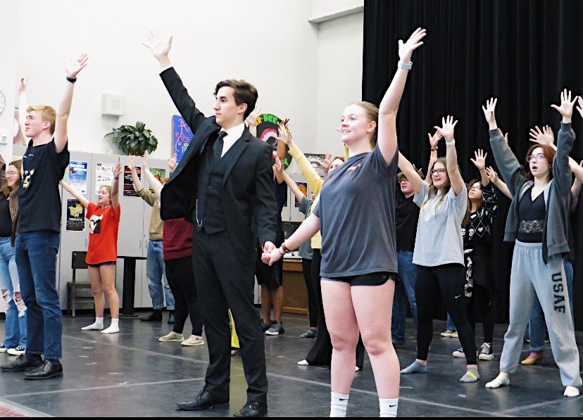 Seniors Ben Kennedy and Keira Mayhue dance together as a couple in the school play. The two seniors have been in drama club for all four years of high school. 
