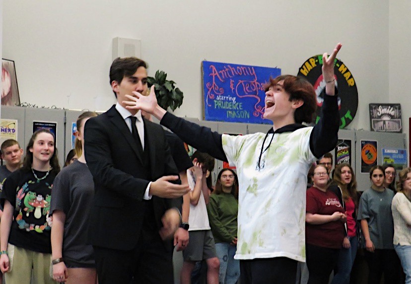 Senior Ben Kennedy and junior Ethan Eisenhart sing while practicing for the school play. Kennedy landed the lead role. 