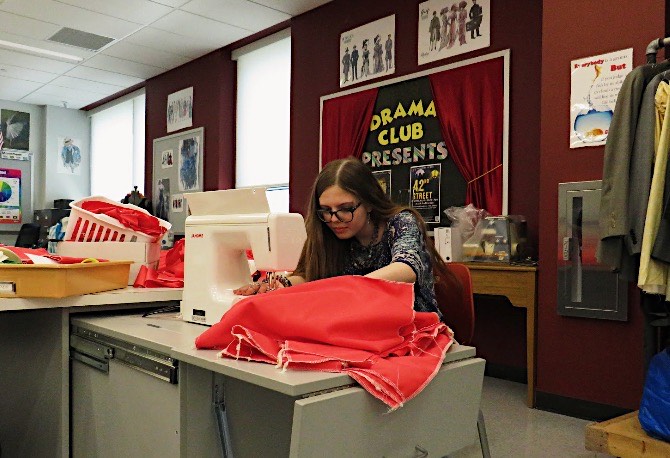 Junior Alyana Noel begins to sew costumes for the spring musical. Noel takes every practice to prepare the costumes for the performers. 