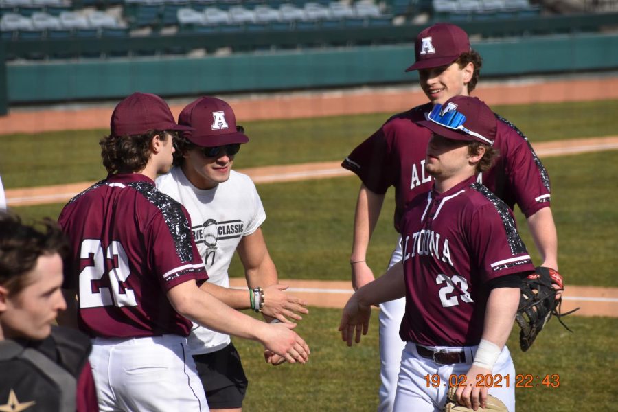 A bond like no other. Junior Connor Sanders meets with seniors Tysen LaRocco, Bryce Eberhart, and Samuel Saylor in between innings. The seniors have been playing together since they were in high school.
