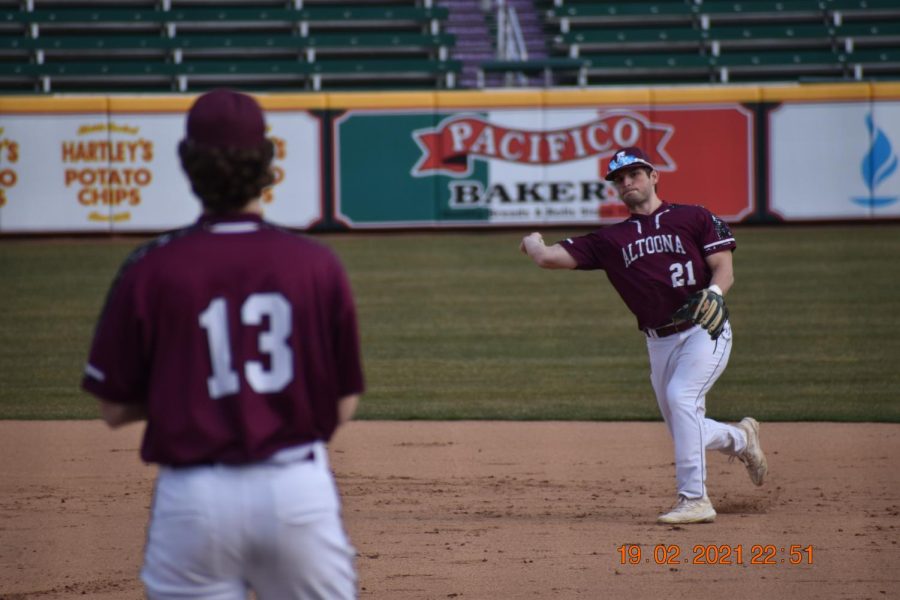 Getting the out. Senior Connor Weyandt throws the ball to senior Samuel Saylor after catching a ground ball. The two players were able to make the out at first. 