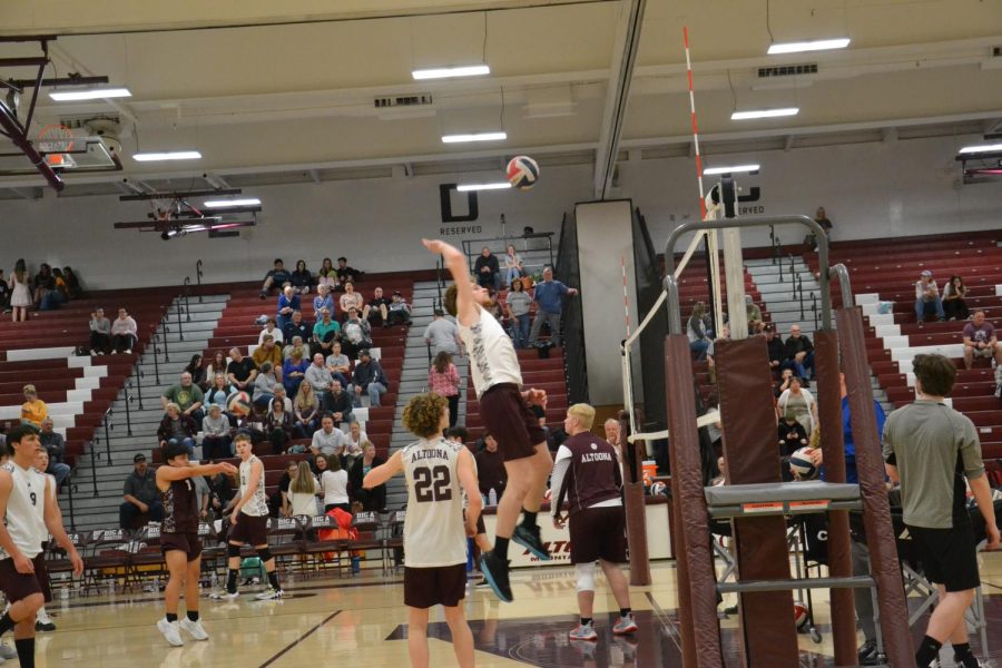 Spike it  Senior Landon Fisher spikes the ball over the net. Fisher scored a point for the team.