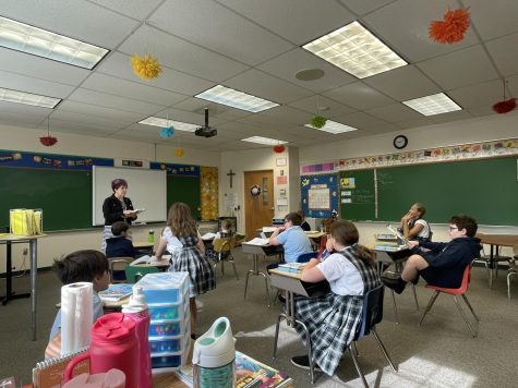 Happy learners. Ms. Decker starts the day with math, while students listen eagerly. 
