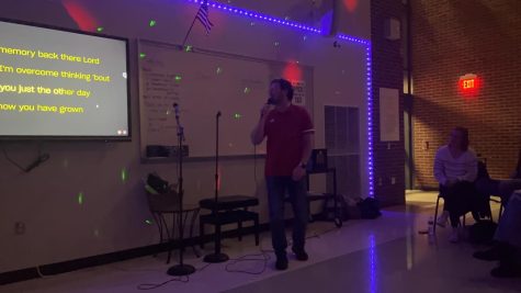 Time to shine. Marasco shows off his talent at the karaoke night held by the chorus.   