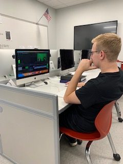 Editing Away Senior Jacob Steinbugl works at his desk to edit an MLTV video. Hes often seen on the MLTV morning show as the morning anchor.