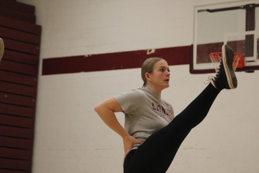 Junior Mykynzee Milchak kicks her leg up as part of the dance. A kick line has been a staple in some of their routines. 