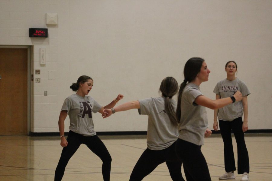 Teammates dance in between routines. 