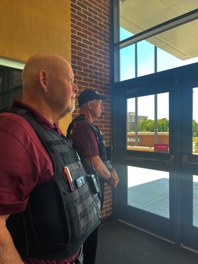 Look forward. Altoona high security guards are on high alert. Security guards guard different entrances to ensure student safety. 