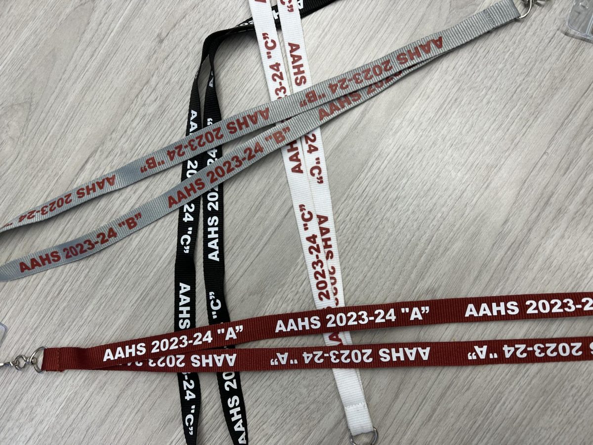 New Style! Students grade levels are now easily spotted by the color of lanyard they wear. Seniors wear black, juniors wear white, sophmores wear maroon, freshman wear grey. 