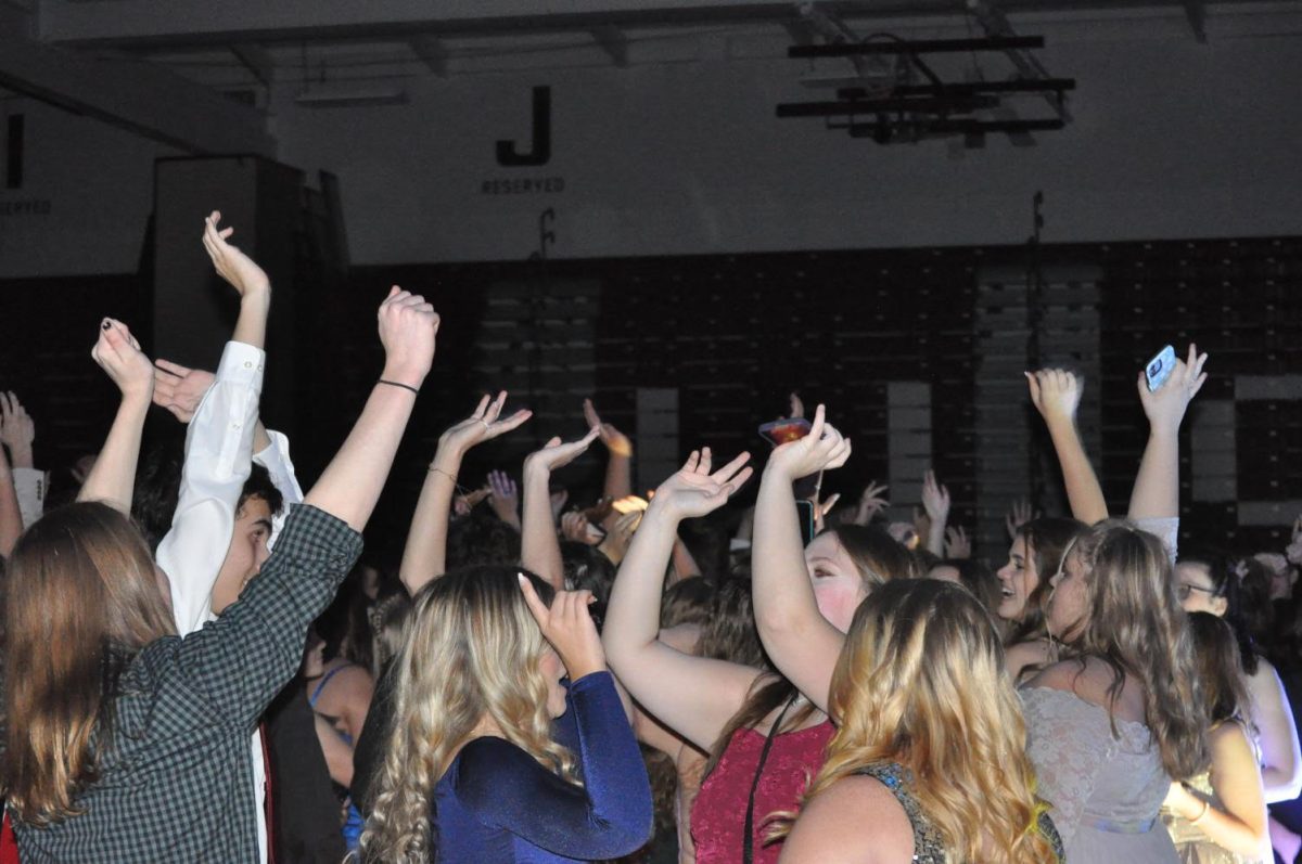 Just dance. Students at last years dance let loose at Homecoming.