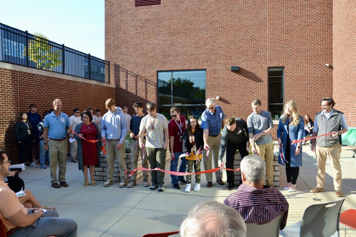 New beginnings. All the participants involved within getting the sensory garden to come to life gather together at the ribbon cutting ceremony. On Sept. 21, the garden was officially opened for the entirety of the school.