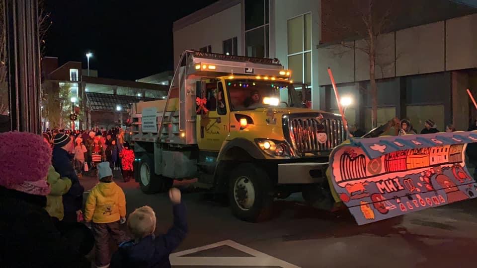 McAuliffe Heights first place snow plow being showcased in the 2019 Christmas parade. The school has won Paint the Plow twice in the past. 