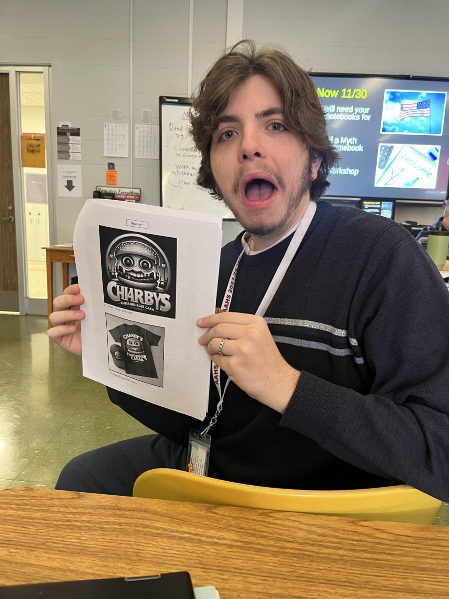 Frighteningly Fun. 
Junior Dominic Zlupko demonstrates the  tone of his assignment for his AP Language and Composition class with a terrified facial expression. Anthony DeRubis created excitement for  his AP students as they were assigned to write an essay by using information from sources that resemble an off-putting restaurant which mimics the settings of the popular Five Nights at Freddys franchise. It’s very different from any other English class I’ve had. Basing work off of a fun concept is a refreshing change, and it fuels me to work on the assignment, Zlupko said. 