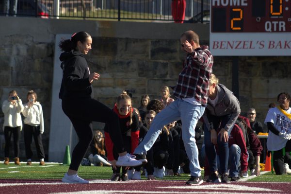 Tagteam. Senior Mia Noel and physics teacher Jeremy Rupeka have been Turkey Bowl halftime partners for two years in a row. 