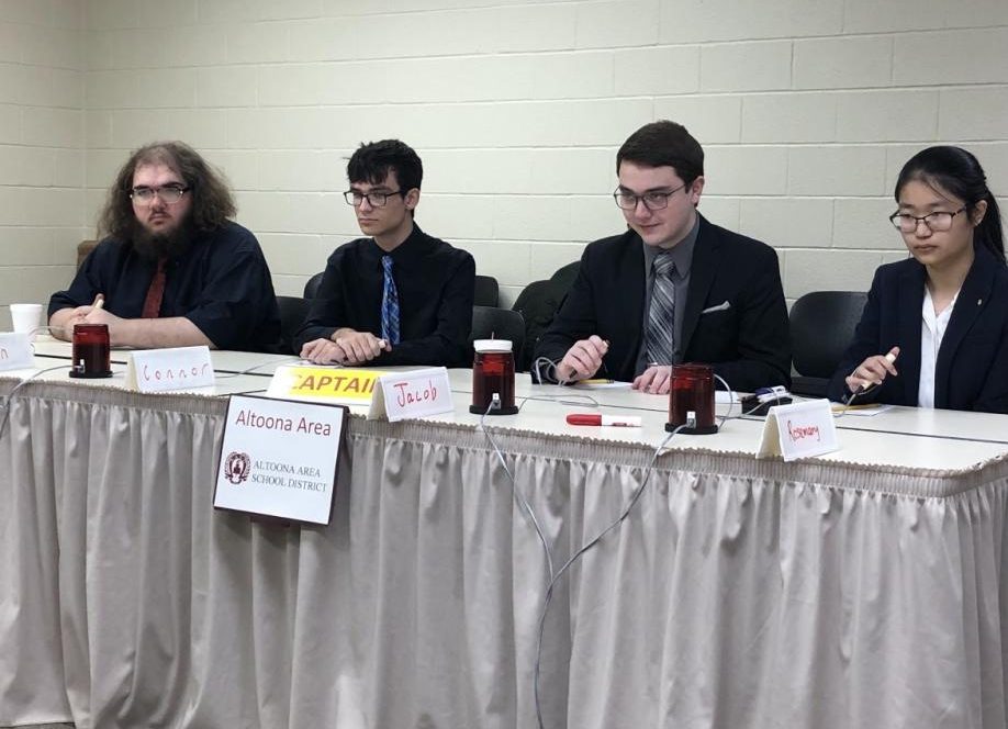 In focus. Scholastic Scrimmage members Logan Walter, Connor Matosziuk, Jacob Ceglar and Rosemary Wei get ready to hit the buzzer to answer. The team placed second in the championship on Nov. 1.