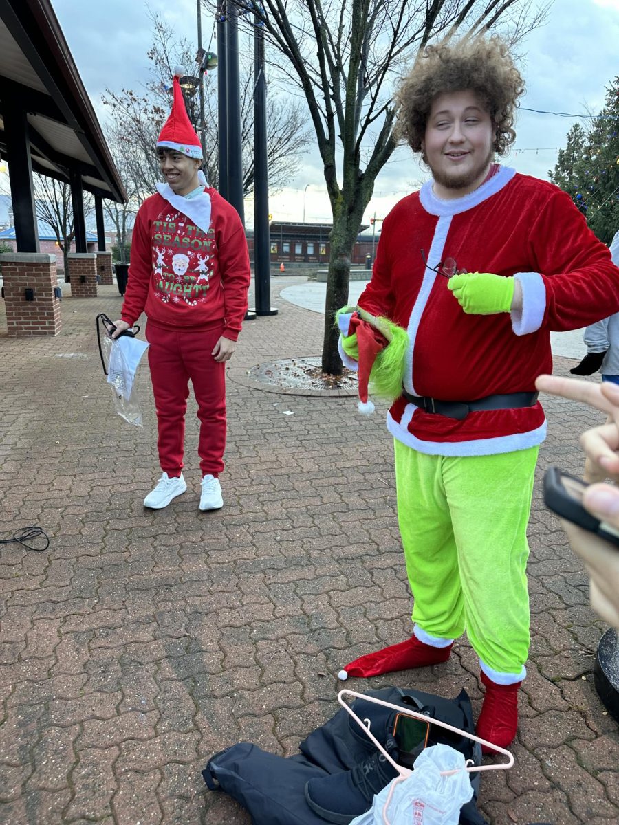 A Helping Hand. Junior Alexander Swalga dresses up as the Grinch for the 5K race that he volunteered for.