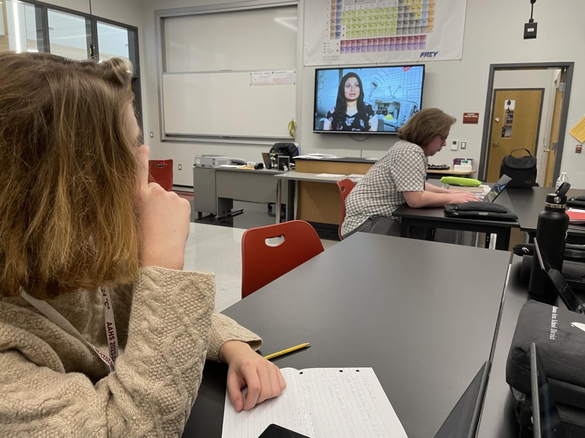 Watch and learn. Junior Eli Rosenberry views a film being played in his physics class. Physics teacher Deidra Dumm often supports students education with video content.